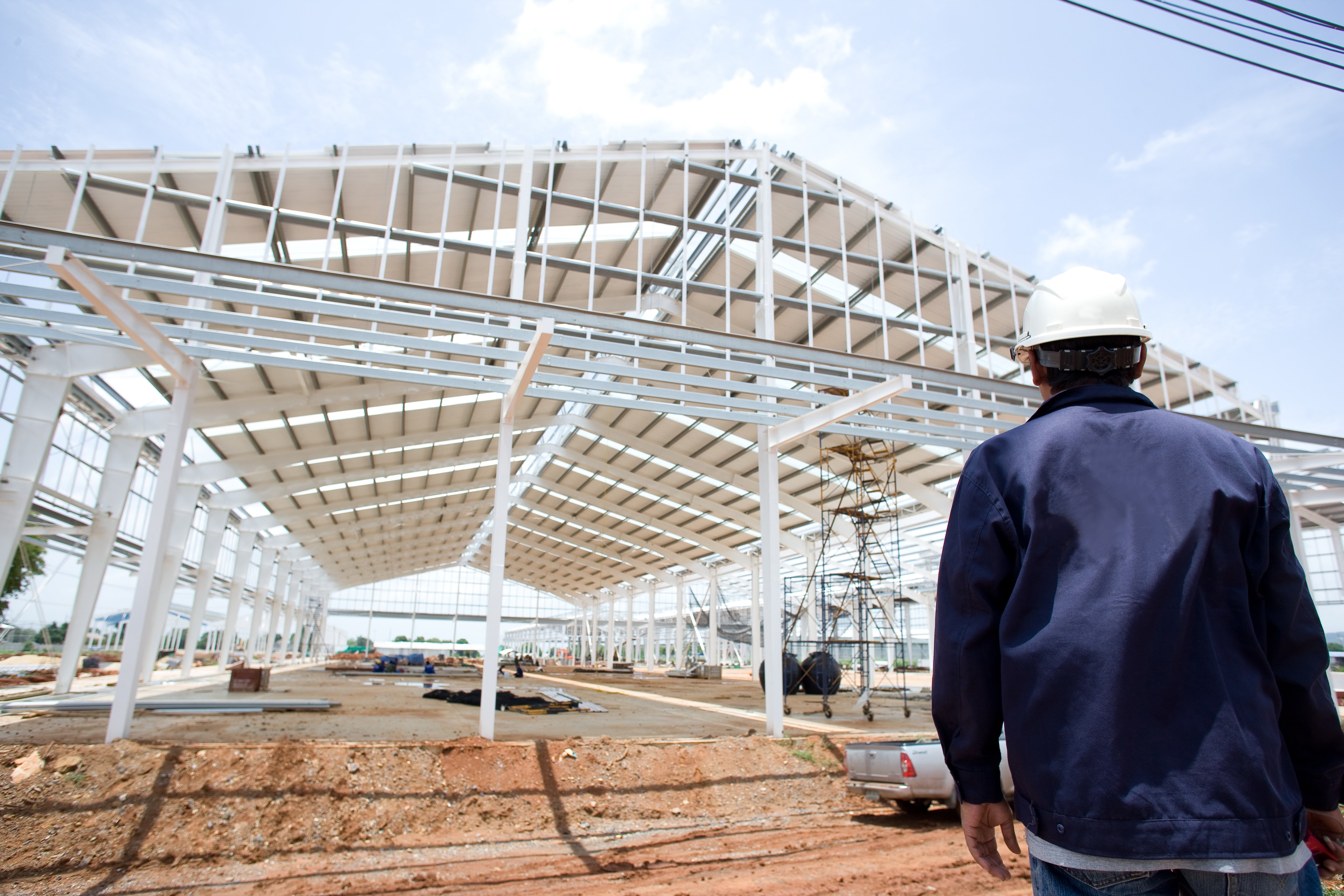 Engineer is looking at roof structure.